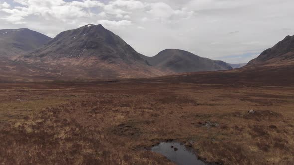 Glencoe Scotland Mountain Range And Brown Moorland Valley Aerial 