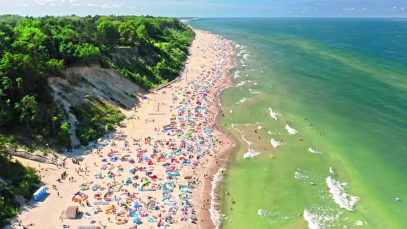 Crowded beach in Poland during pandemic, aerial view, Baltic Sea