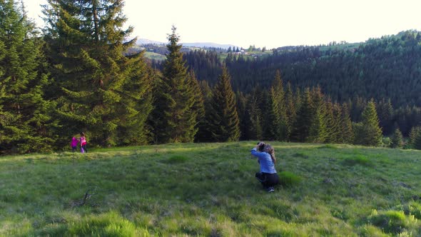 Photographer Woman Walking, Spring Day in Forest