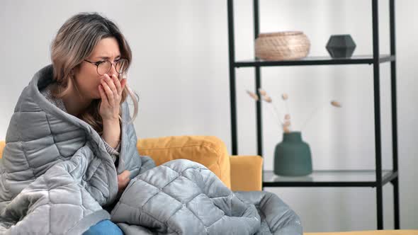 Unwell Female Coughing Chilling Wrapping in Blanket First Symptoms Influenza