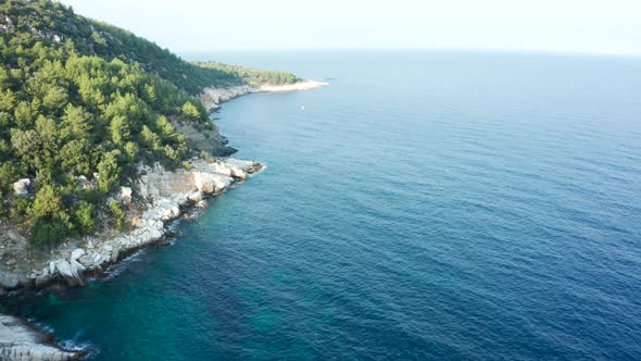 Drone Footage of Beautiful Rocky Coast Line with Blue Sea Water