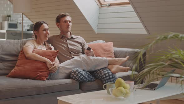 Hetero Couple Watching TV on Weekend