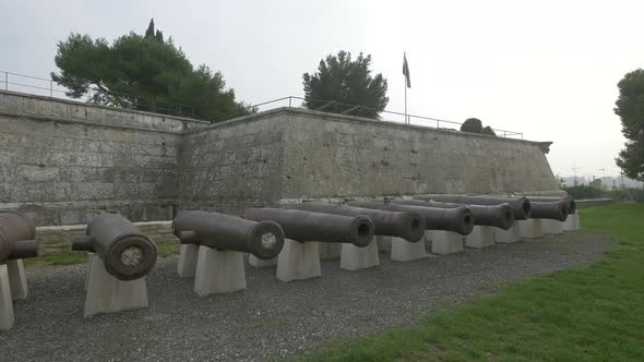 Old cannons by the stone walls at Pula Castle