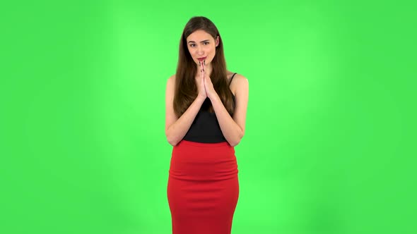 Girl Keeps Palm Together and Asks for Something. Green Screen