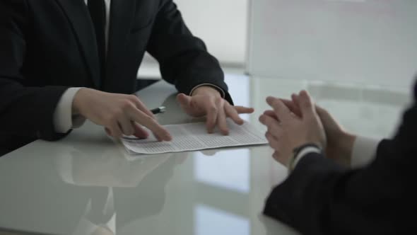 Businessman Giving Male Colleague Cooperation Contract for Signing, Partnership