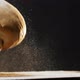 Loaf of Homemade Bread with Flour Falls Down Onto Dark Table - VideoHive Item for Sale