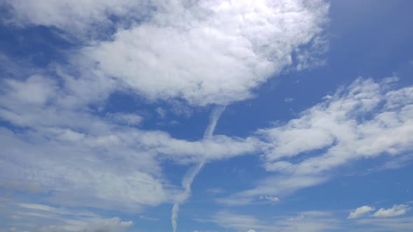 Time lapse of white cloud moving pass around sky background