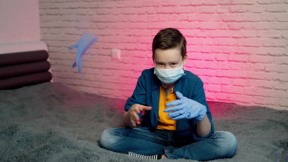 Boy wearing medical mask and gloves