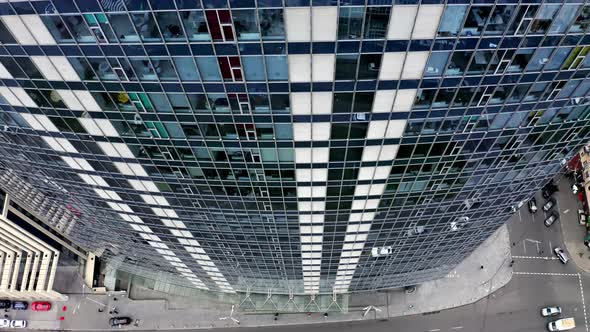 Aerial Top view of Long Windows of the Office Building. Glass Skyscrapers. Flying near Modern Glass