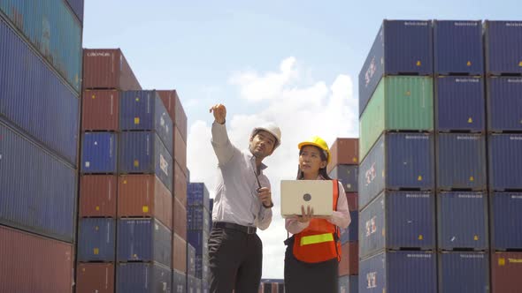 Group of Asian teamwork of workers people team company working in cargo container