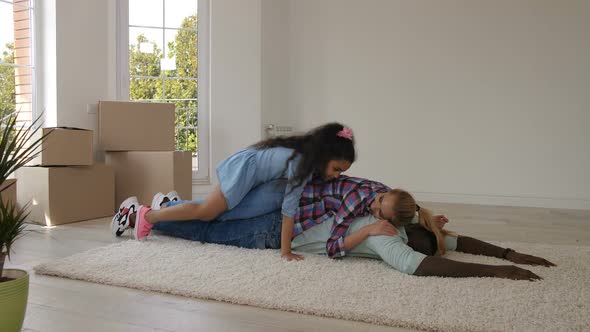 Family Making a Heap on Carpet on Moving Day