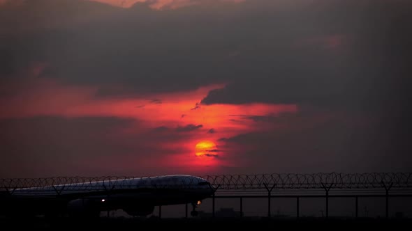 Plane Landing At Evening