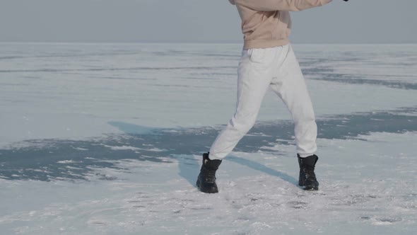 Stylish Young Woman Professional Dancer Dancing Energetic Jazz Funk or Hip Hop on Frozen Lake in