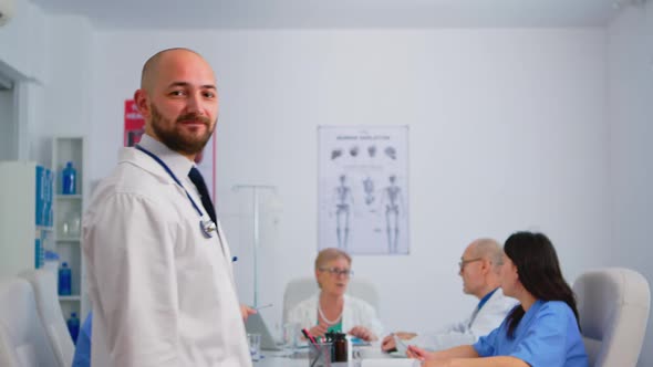 Portrait of Young Man Doctor Smiling at Camera