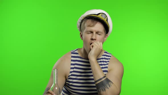 Young Sailor Man Drinks Vodka. Seaman Guy in Sailor's Vest. Chroma Key