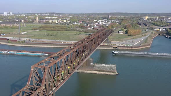 Empty Fright Train Crossing a Bridge over a River