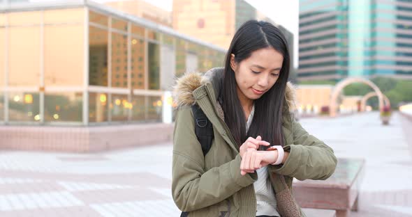 Woman using smart watch at outdoor