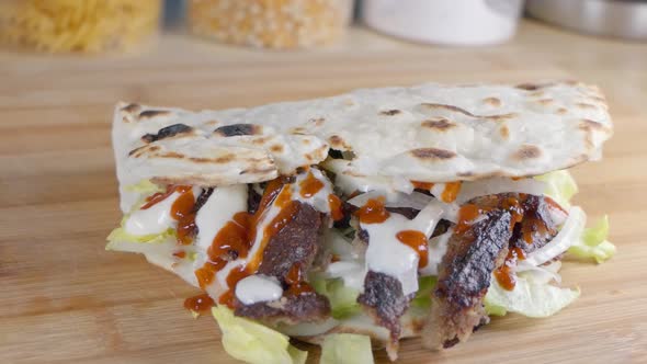 Slider Shot of a Doner Kebab in Naan Bread at Home on the Kitchen Counter