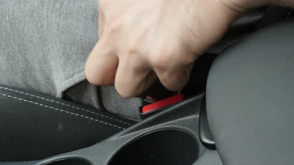 Fastening three-point seat belt in car 4K video