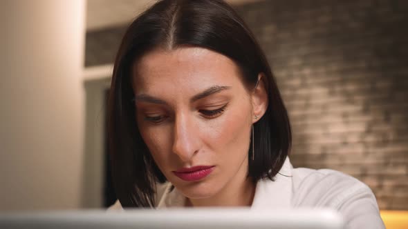 Portrait of Pretty Caucasian Woman Working on Laptop