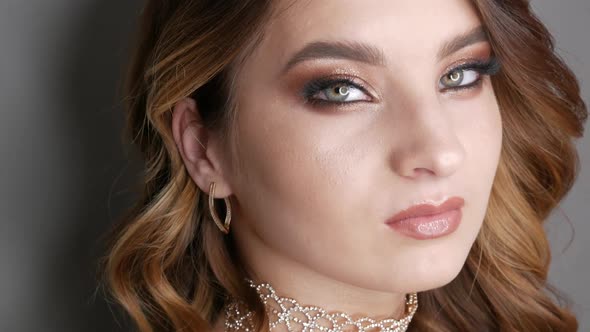 Portrait of Beautiful Young Girl Model in Stylish Evening Make Up Smoky Eyes Posing
