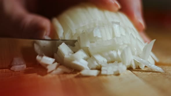 Chopping Onions Chef on a Wooden Board