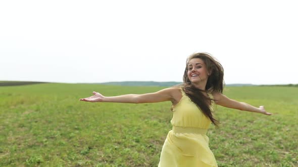 Happy Woman Relaxing in Field