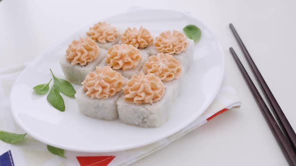 Various Types of Sushi Are Beautifully Served in a Rustic Style