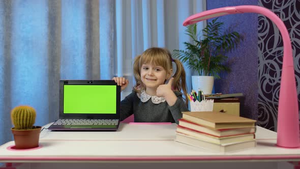 Child Girl Studying Elearning Distance Education Kid Pointing at Laptop Green Screen Chroma Key