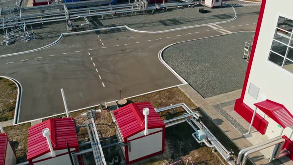 The Drone Takes Off Over a Power Plant in the Field