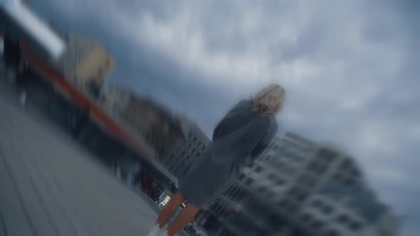 Alone Woman Watching Clouds at City Landscape in Evening Street Lights