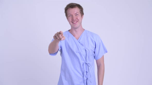 Portrait of Happy Young Man Patient Pointing at Camera