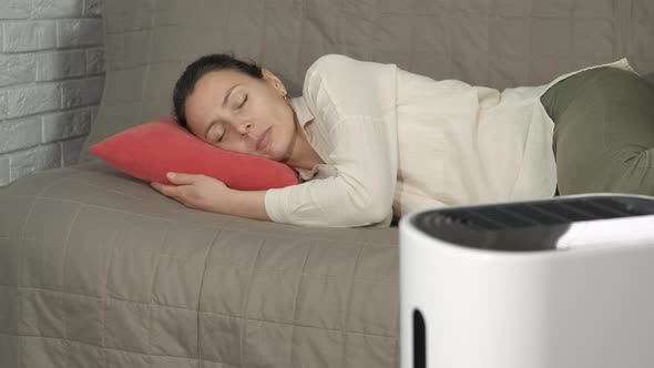 Tranquil Woman By Humidifier