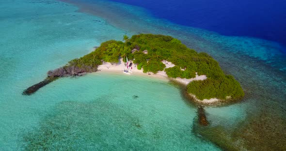 Wide birds eye clean view of a sunshine white sandy paradise beach and turquoise sea background in v