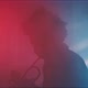 A trumpeter plays the trumpet in a room with smoke and neon lights - VideoHive Item for Sale