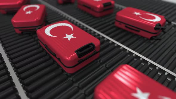 Many Travel Suitcases with Flag of Turkey on Conveyer