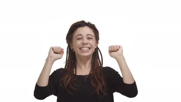 Video of Happy Attractive Woman with Dreadlocks and Ear Tunnels Receive Good News Reacting to Win