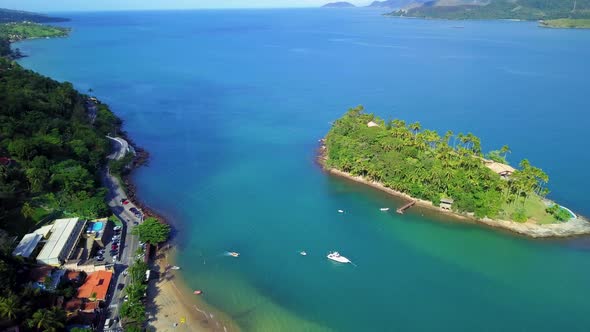 Drone view of a small islet near the coastline.