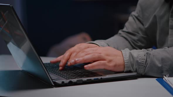 Closeup of Businessman Hands on Keyboard Sitting at Desk Table