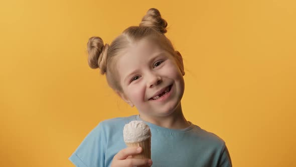 Happy Toothless Girl Eating Vanilla Ice Cream on Yellow Background