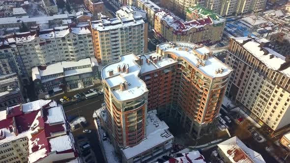 Aerial view of a big city with tall residential buildings under construction