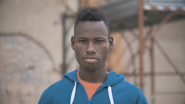 sad pensive black african man staring at camera. Thoughts,depression, sadness