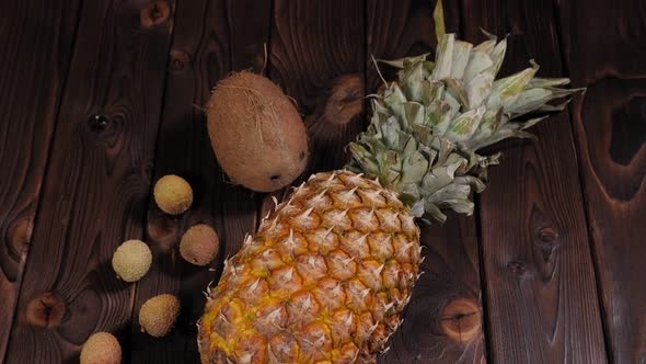 Closeup of Pineapple Coconut and Lychee on a Wooden Background