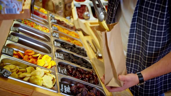 Man Buying Dried Fruit in the Grocery