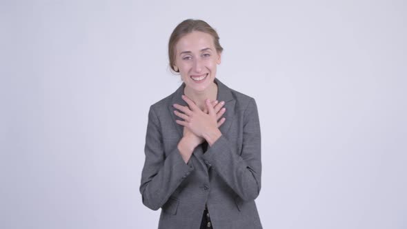 Happy Young Blonde Businesswoman Looking Surprised