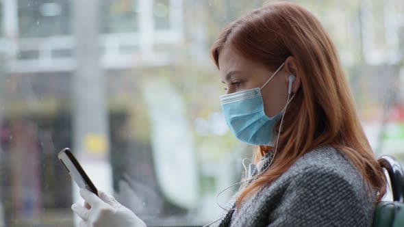 Female Passenger in a Safety Precaution Wears a Medical Mask and in Public Places To Protect Against