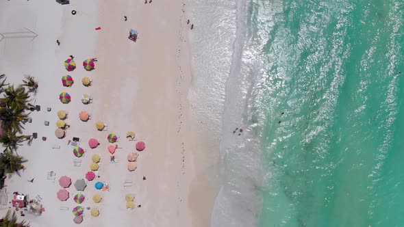 Aerial Top Paradise Beach with Umbrellas and Turquoise Ocean Nungwi Zanzibar