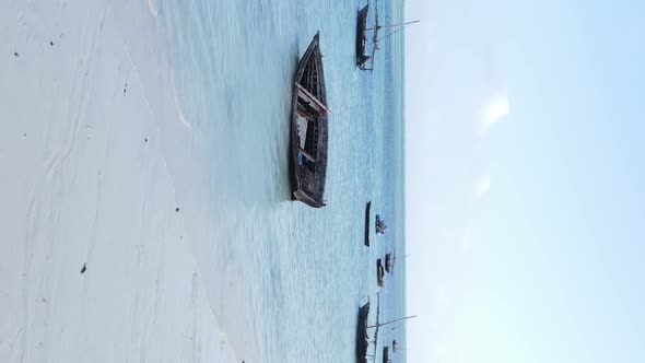 Vertical Video Boats in the Ocean Near the Coast of Zanzibar Tanzania Aerial View