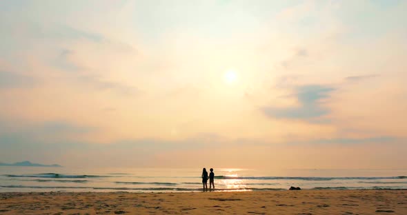 Young Couple Looking Towards the Sun, Against the Sunset, Holding Hands, Go To the Sea, a Romantic