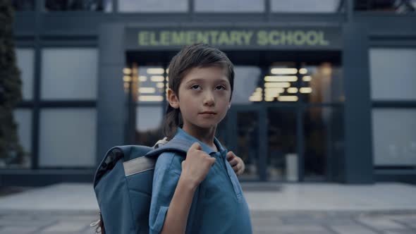 Cute Teen Boy Standing at School Building Close Up